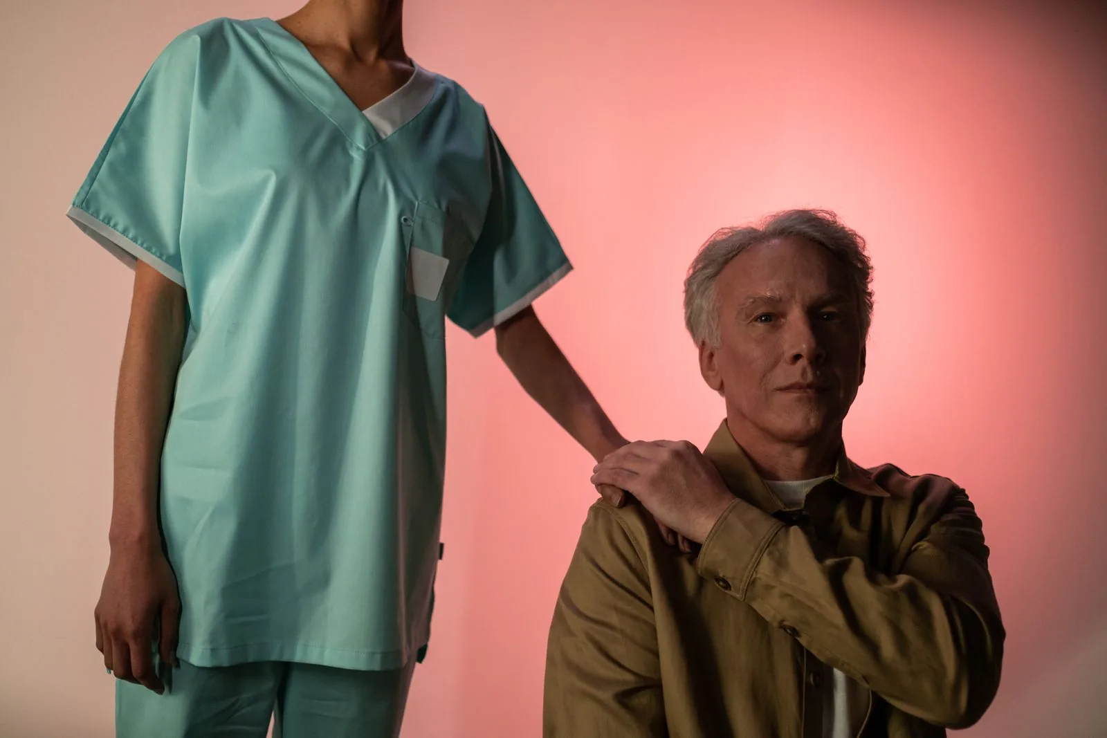 A nurse reassuring an older man